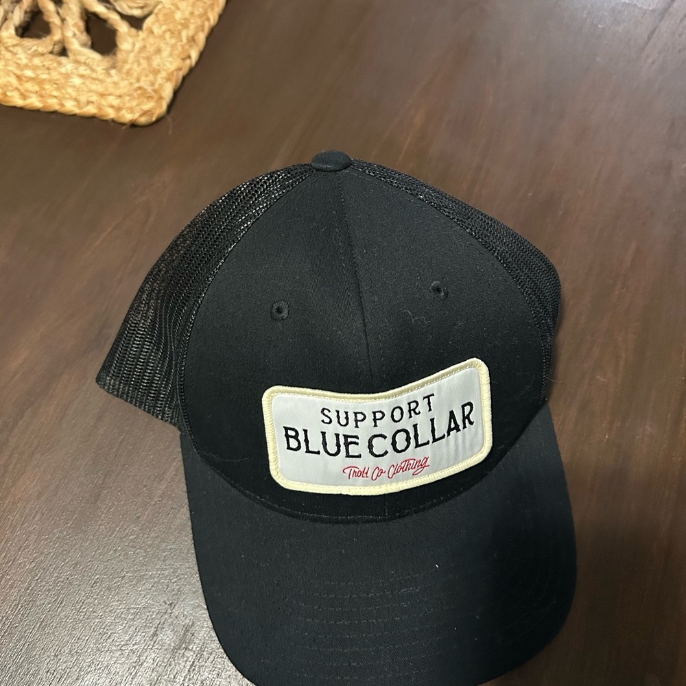 The Classic Black Trucker Hat with 'Support Blue Collar' Patch